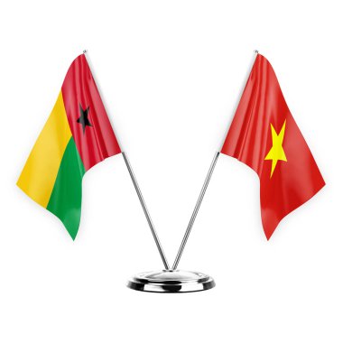 Two table flags isolated on white background 3d illustration, guinea-bissau and vietnam