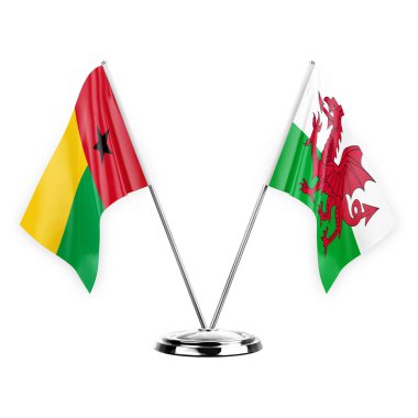 Two table flags isolated on white background 3d illustration, guinea-bissau and wales
