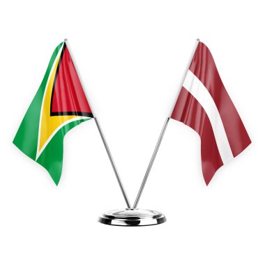 Two table flags isolated on white background 3d illustration, guyana and latvia