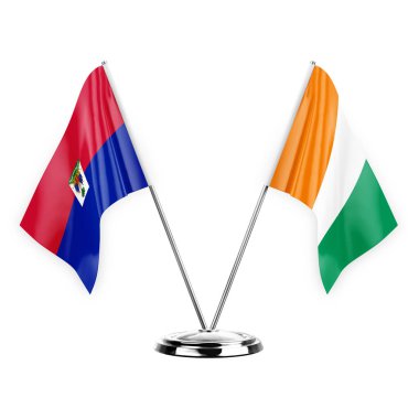 Two table flags isolated on white background 3d illustration, haiti and ivory coast