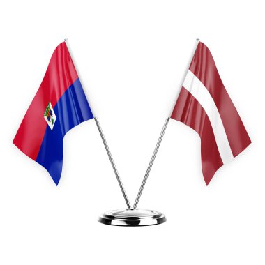 Two table flags isolated on white background 3d illustration, haiti and latvia