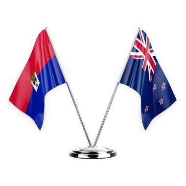 Two table flags isolated on white background 3d illustration, haiti and new zealand