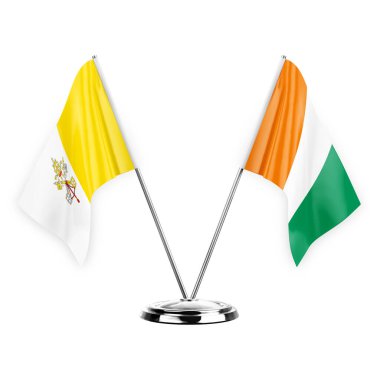 Two table flags isolated on white background 3d illustration, holy see and ivory coast
