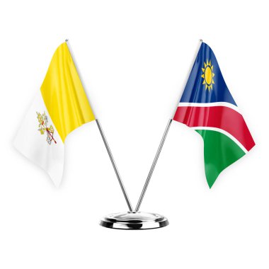 Two table flags isolated on white background 3d illustration, holy see and namibia