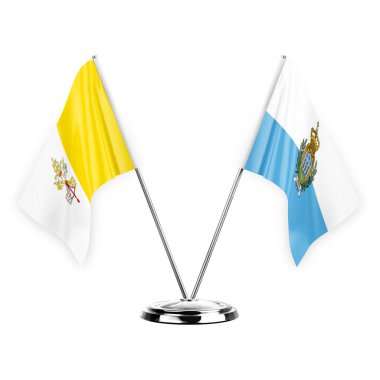 Two table flags isolated on white background 3d illustration, holy see and san marino