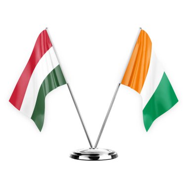 Two table flags isolated on white background 3d illustration, hungary and ivory coast