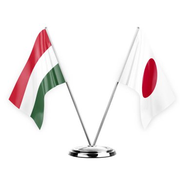 Two table flags isolated on white background 3d illustration, hungary and japan