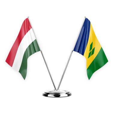Two table flags isolated on white background 3d illustration, hungary and saint vincent and the grenadines