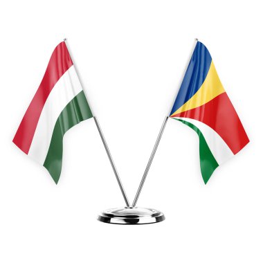 Two table flags isolated on white background 3d illustration, hungary and seychelles