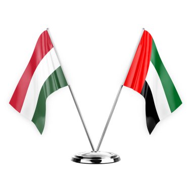 Two table flags isolated on white background 3d illustration, hungary and united arab emirates
