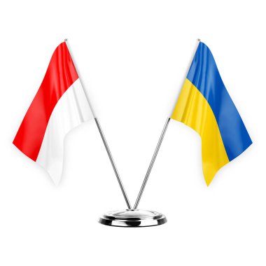 Two table flags isolated on white background 3d illustration, indonesia and ukraine
