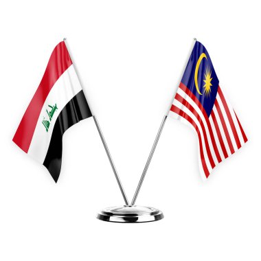 Beyaz arka planda izole edilmiş iki masa bayrağı. 3 boyutlu illüstrasyon, Irak ve Malezya.