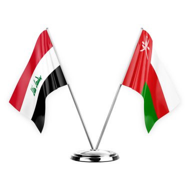 Beyaz arka planda izole edilmiş iki masa bayrakları. 3 boyutlu illüstrasyon, Irak ve Umman.