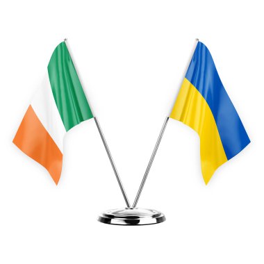 Two table flags isolated on white background 3d illustration, ireland and ukraine