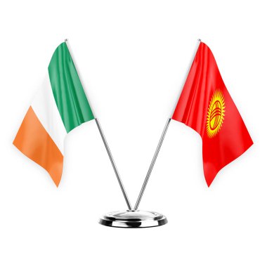 Two table flags isolated on white background 3d illustration, ireland and kyrgyzstan