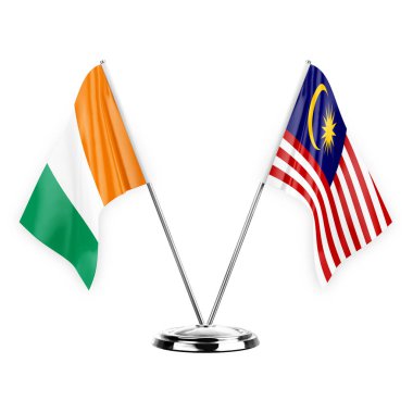 Two table flags isolated on white background 3d illustration, ivory coast and malaysia