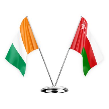 Two table flags isolated on white background 3d illustration, ivory coast and oman
