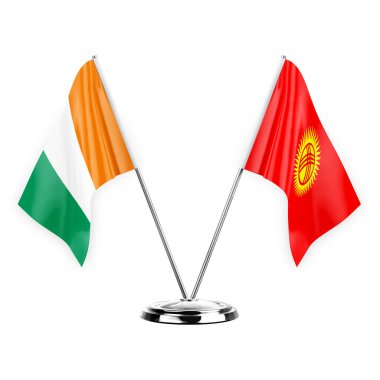 Two table flags isolated on white background 3d illustration, ivory coast and kyrgyzstan