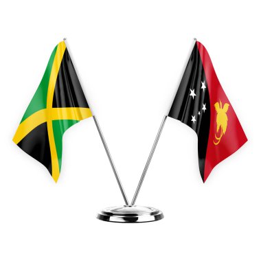 Two table flags isolated on white background 3d illustration, jamaica and papua new guinea