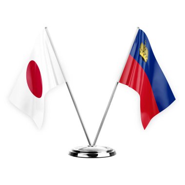Two table flags isolated on white background 3d illustration, japan and liechtenstein