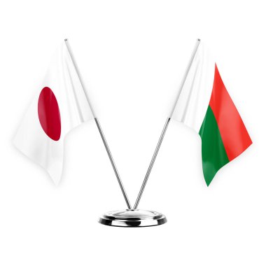 Two table flags isolated on white background 3d illustration, japan and madagascar