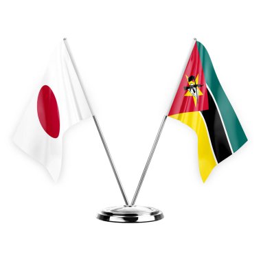Two table flags isolated on white background 3d illustration, japan and mozambique