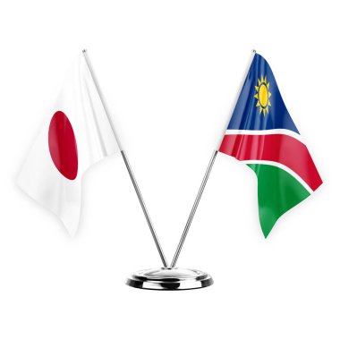 Two table flags isolated on white background 3d illustration, japan and namibia