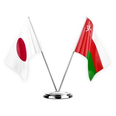 Two table flags isolated on white background 3d illustration, japan and oman