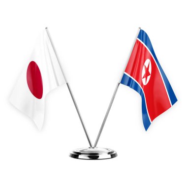 Two table flags isolated on white background 3d illustration, japan and north korea