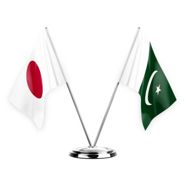 Two table flags isolated on white background 3d illustration, japan and pakistan