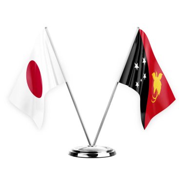 Two table flags isolated on white background 3d illustration, japan and papua new guinea