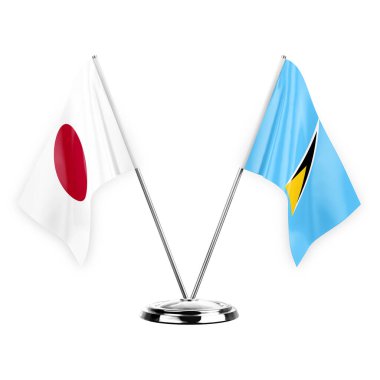 Two table flags isolated on white background 3d illustration, japan and saint lucia
