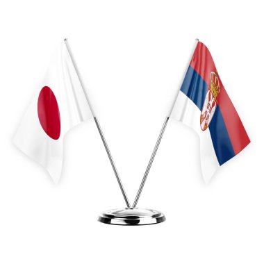 Two table flags isolated on white background 3d illustration, japan and serbia