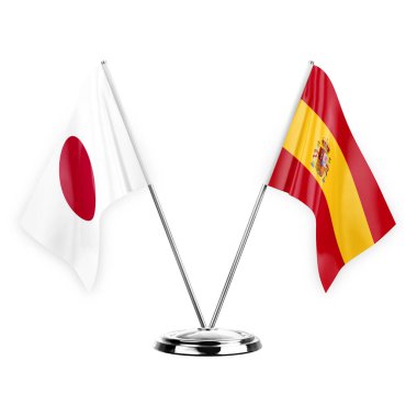 Two table flags isolated on white background 3d illustration, japan and spain