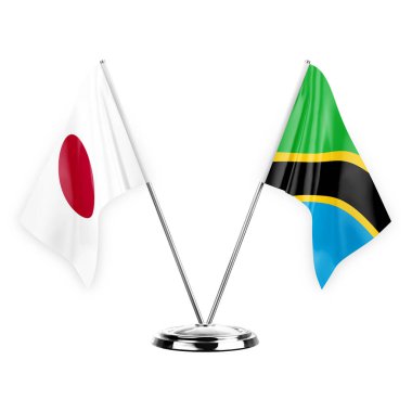 Two table flags isolated on white background 3d illustration, japan and tanzania