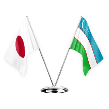 Two table flags isolated on white background 3d illustration, japan and uzbekistan