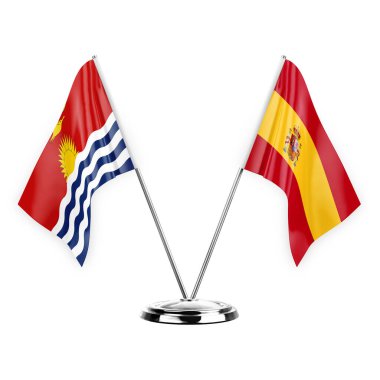 Beyaz arka planda izole edilmiş iki masa bayrağı. 3D illüstrasyon, kiribati ve İspanya.