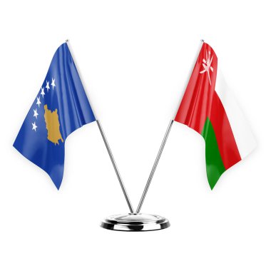 Beyaz arka planda izole edilmiş iki masa bayrağı. 3D illüstrasyon, Kosova ve Umman.