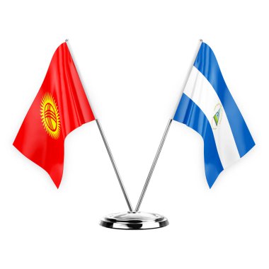 Two table flags isolated on white background 3d illustration, kyrgyzstan and nicaragua