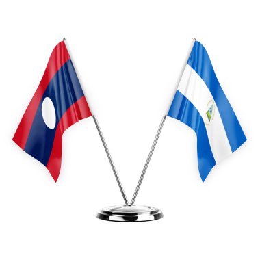 Two table flags isolated on white background 3d illustration, laos and nicaragua