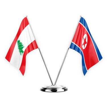 Two table flags isolated on white background 3d illustration, lebanon and north korea