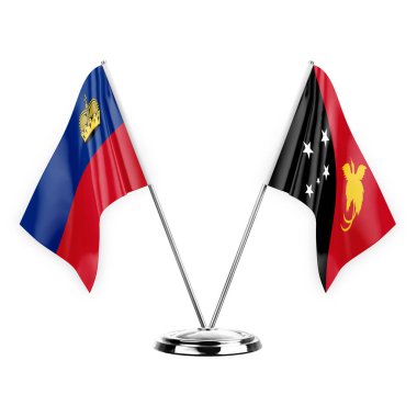 Two table flags isolated on white background 3d illustration, liechtenstein and papua new guinea