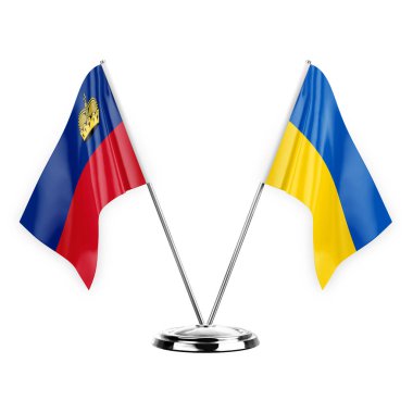 Two table flags isolated on white background 3d illustration, liechtenstein and ukraine