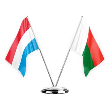 Two table flags isolated on white background 3d illustration, luxembourg and madagascar