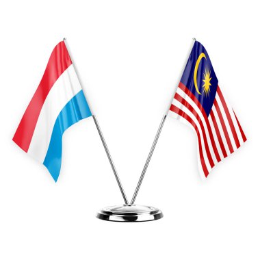 Two table flags isolated on white background 3d illustration, luxembourg and malaysia