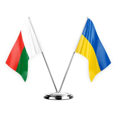 Two table flags isolated on white background 3d illustration, madagascar and ukraine