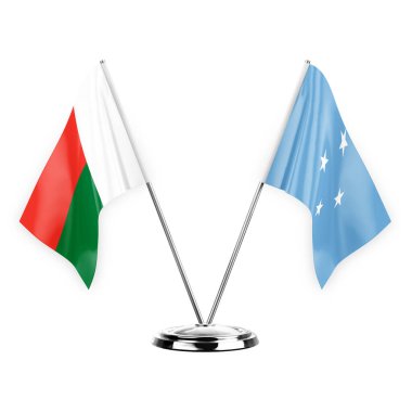 Two table flags isolated on white background 3d illustration, madagascar and micronesia