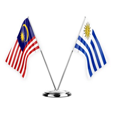 Two table flags isolated on white background 3d illustration, malaysia and uruguay
