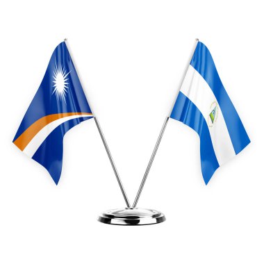 Two table flags isolated on white background 3d illustration, marshall islands and nicaragua