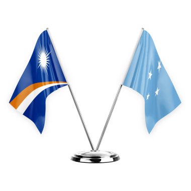 Two table flags isolated on white background 3d illustration, marshall islands and micronesia